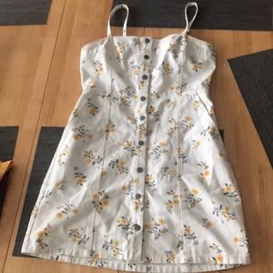 White jean dress with yellow flowers